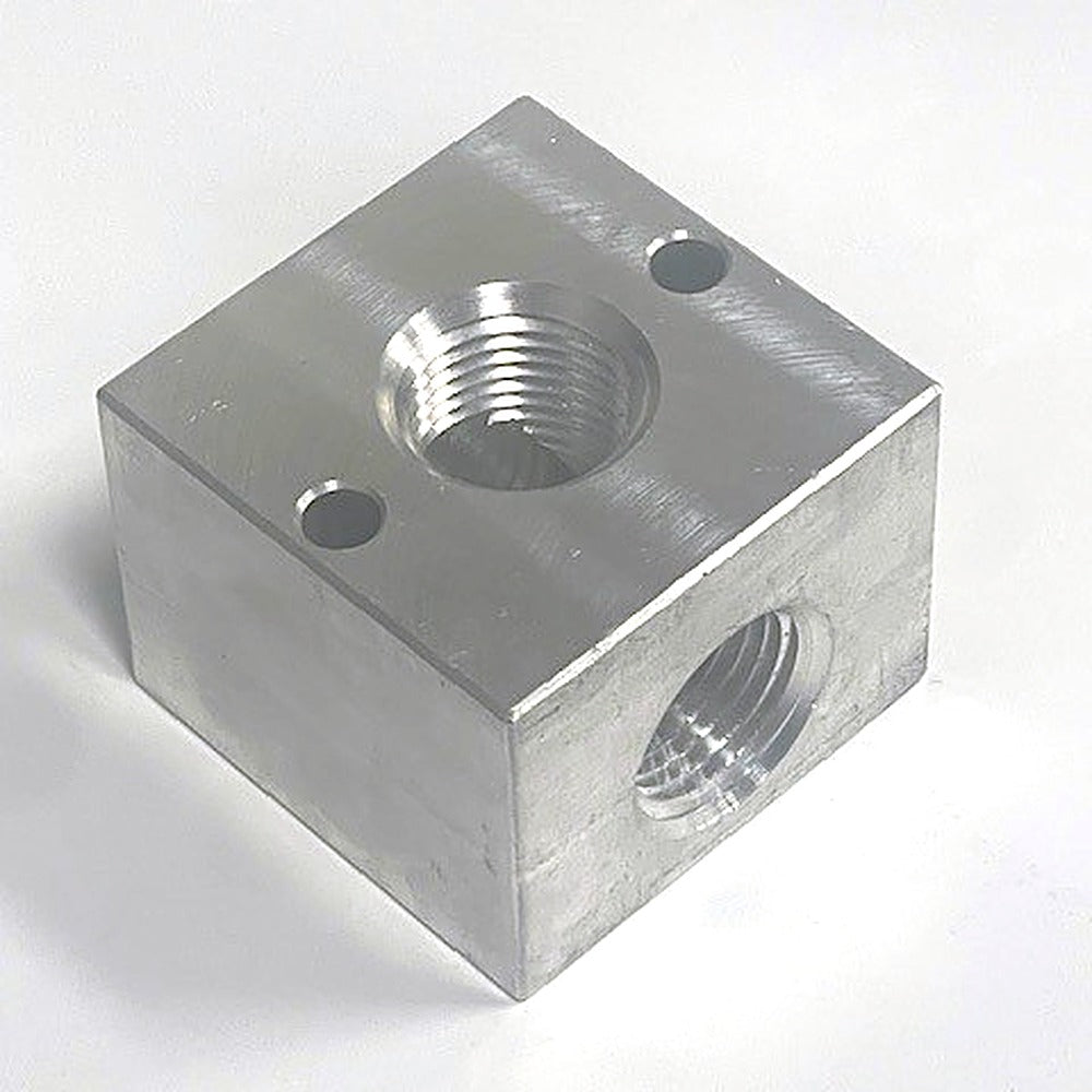 1/2 in. 3-way aluminum unloader / bypass block, angled view showing NPT ports and mounting holes