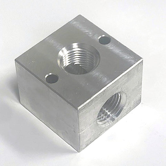 1/2 in. 3-way aluminum unloader / bypass block, angled view showing NPT ports and mounting holes